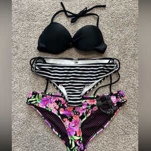 Women's size large bikini lot
Black Bikini Top with Striped and Floral Bottoms